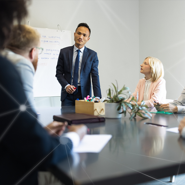 A Man Discussing a Data Breach with Employees