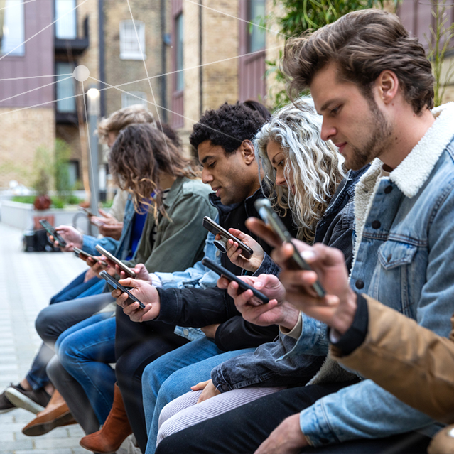 A Group of People Staring at Their Phones