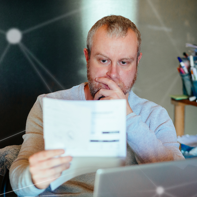 A Man Reading a Breach Cost Report