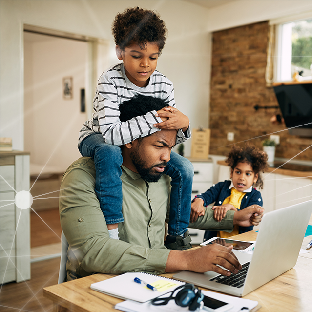 Image of man working from home with kids to represent the privacy protection needed as an employee benefit