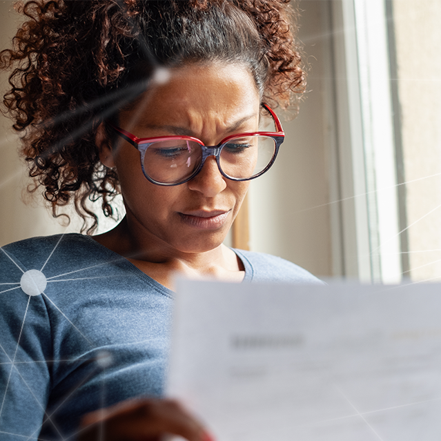 Woman looking at a breach notification letter