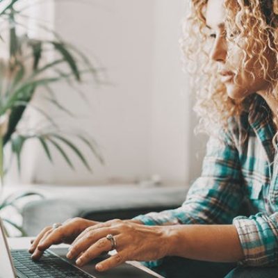 Woman browsing on laptop.